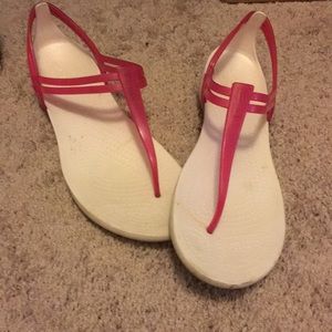 White and pink crocs sandals